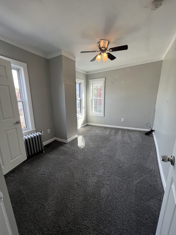 696 Broadway, Unit 1 Chelsea, MA 02150 - Photo 10 of 12 a view of an empty room with a window