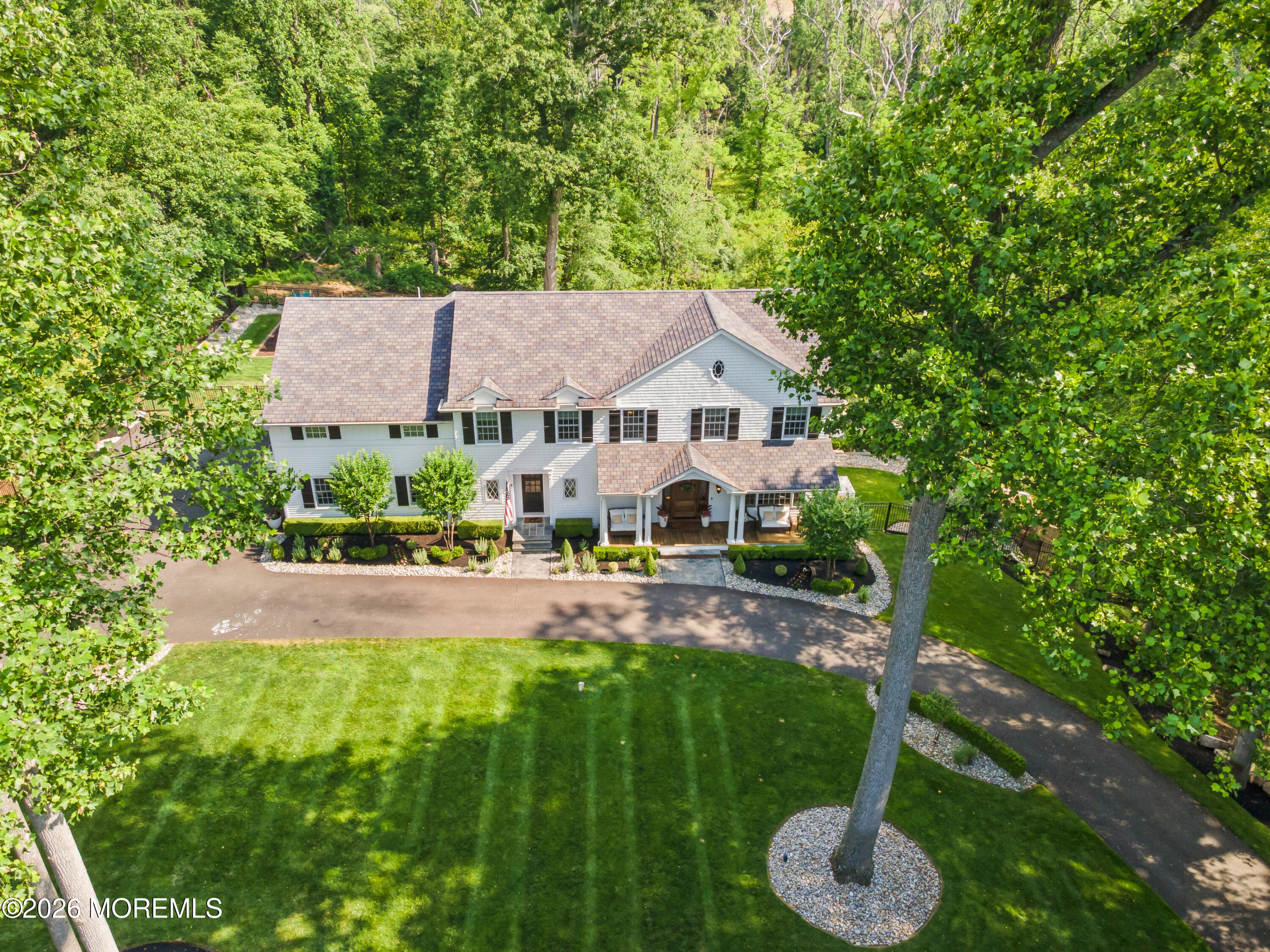 92 Tulip Lane Colts Neck, NJ 07722 - Photo 50 of 55 a aerial view of a house with swimming pool and garden
