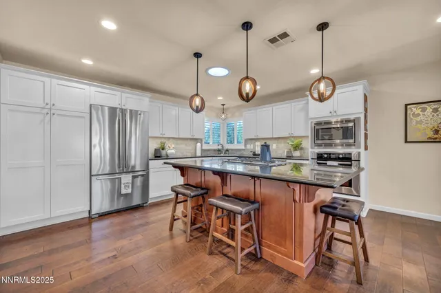 a living room with furniture fireplace and flat screen tv
