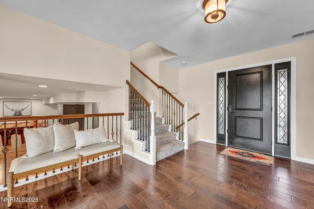 a large white kitchen with a large window