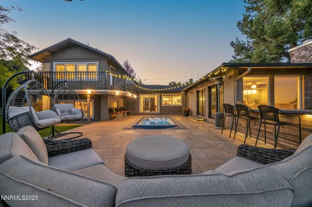 a view of a house with swimming pool and porch