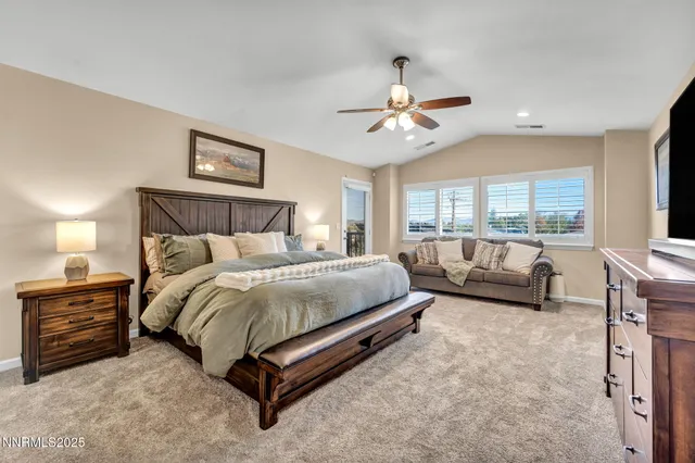 a view of a house with a tree and plants