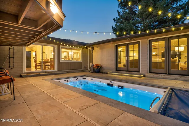 a view of swimming pool with outdoor seating