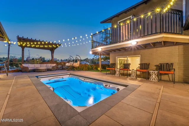 a view of a chairs and table in the patio