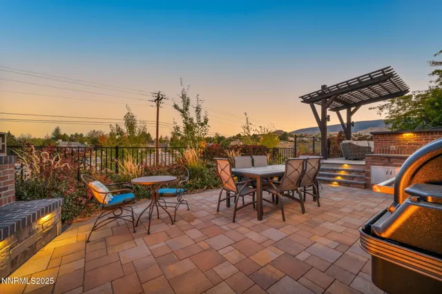 a front view of a house with a yard and a garage