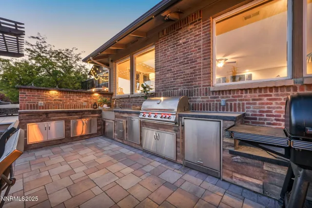 an open kitchen with a dining table and chairs