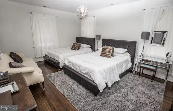a bedroom with a bed and a chair
