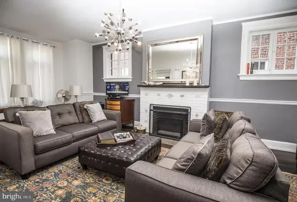 a bathroom with a granite countertop sink a toilet and mirror