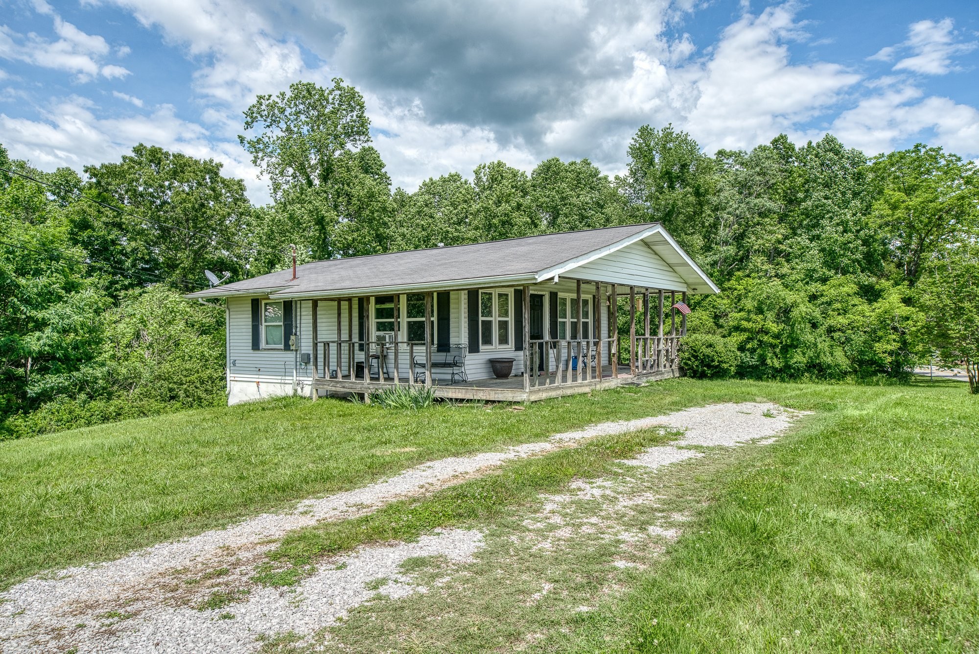 1121 East Gooseneck Road Doyle, TN 38559 - Photo 1 of 20 a view of a house with a yard and a garden