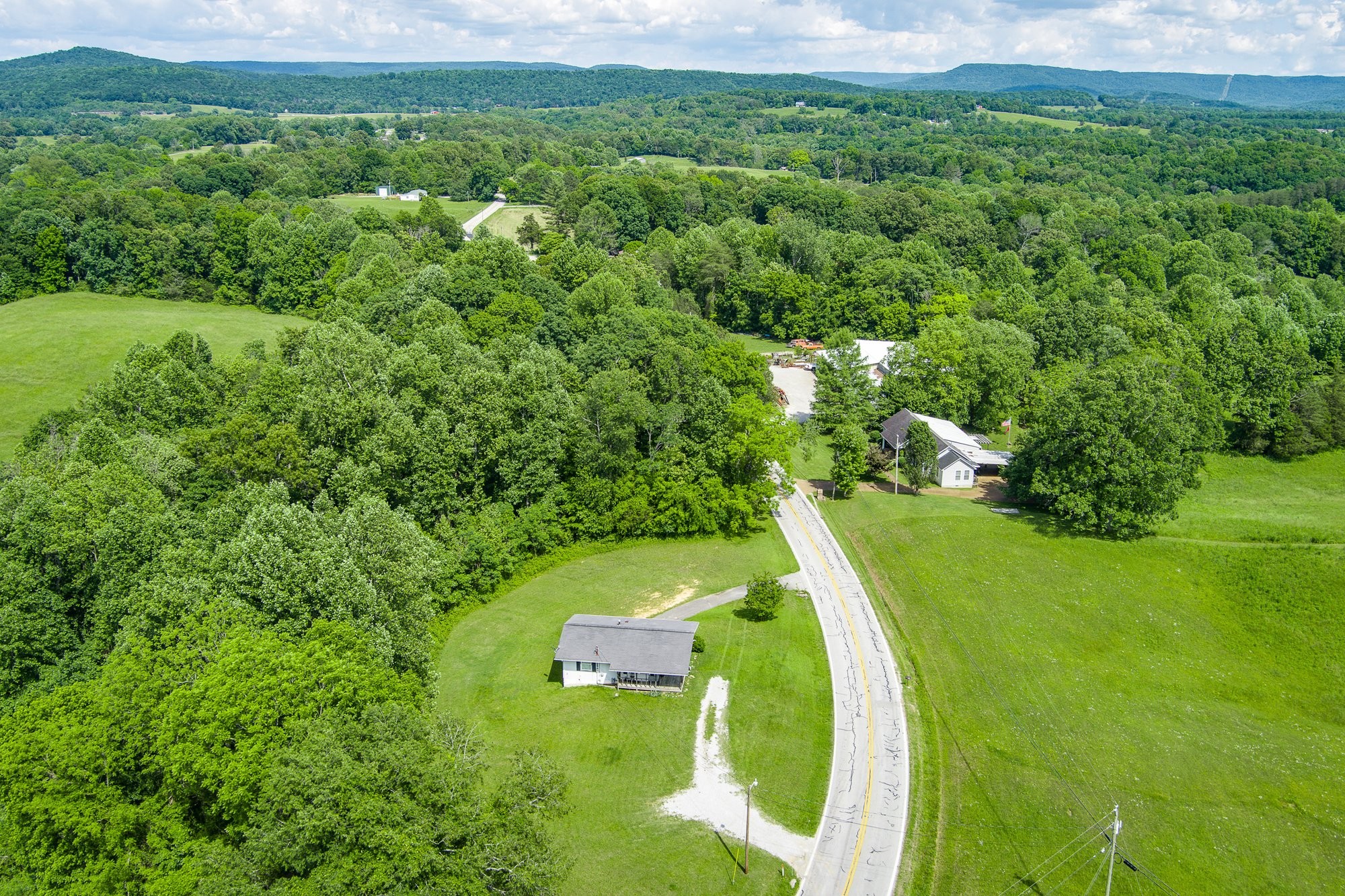 1121 East Gooseneck Road Doyle, TN 38559 - Photo 15 of 20 a view of a lake with huge green field and trees