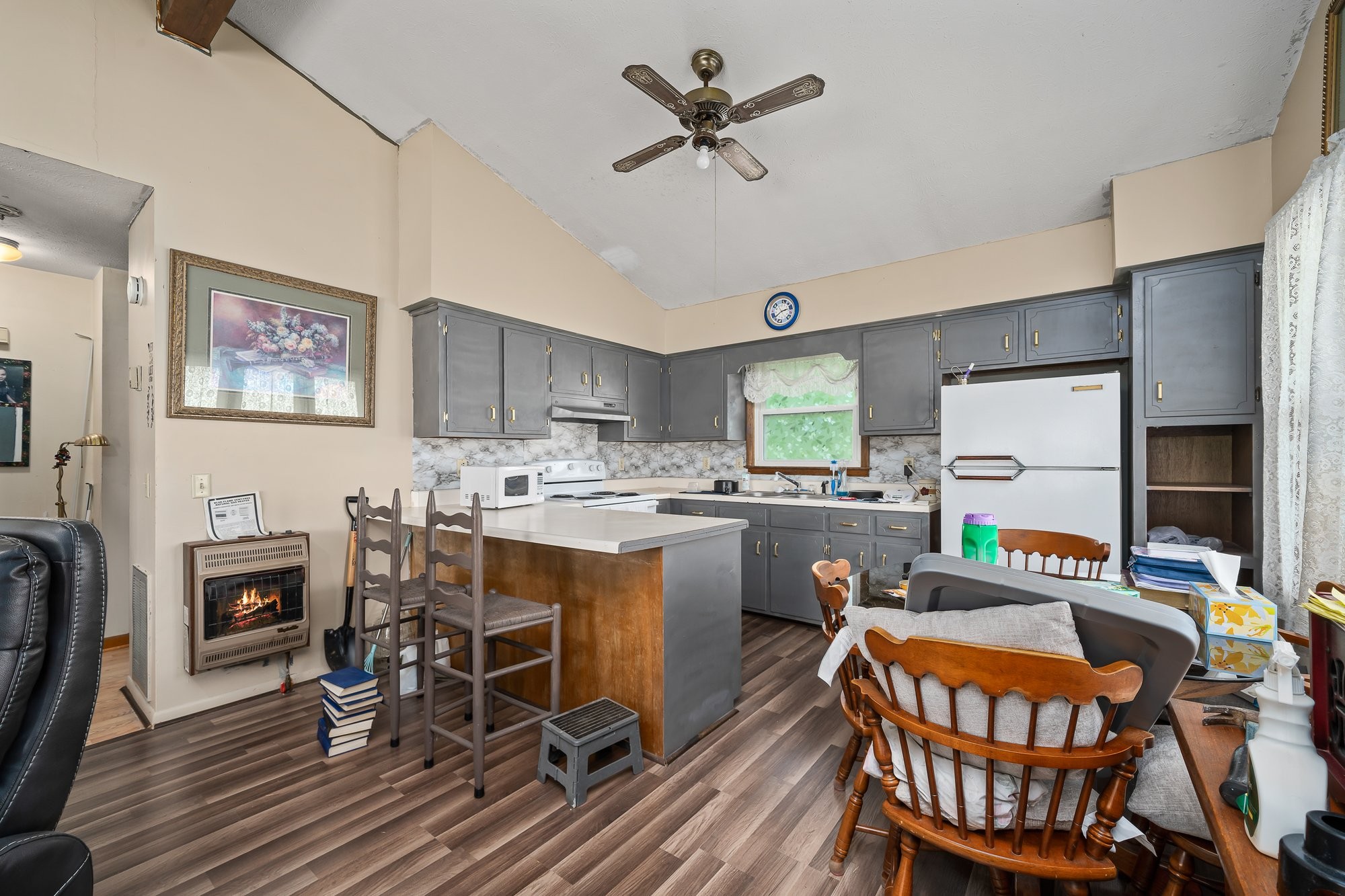 1121 East Gooseneck Road Doyle, TN 38559 - Photo 7 of 20 a kitchen with stainless steel appliances a dining table chairs and a refrigerator