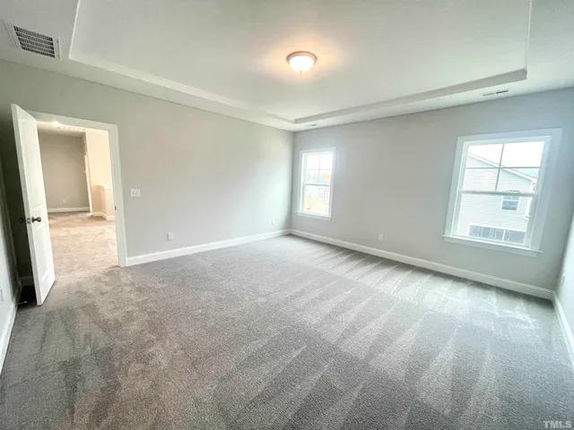 a view of a livingroom with wooden floor and a window