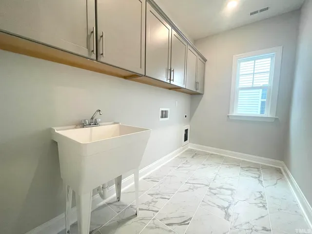 a view of bathroom with dual sinks