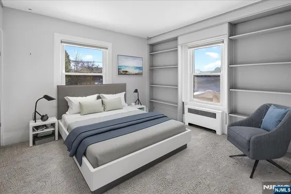 a bedroom with bed and a couch