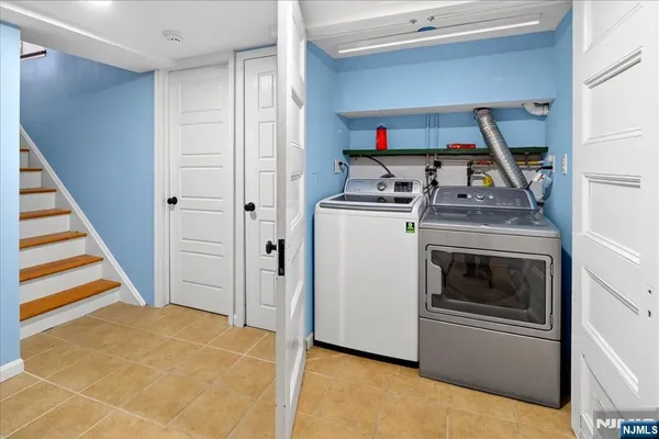 a view of a kitchen with washer and dryer