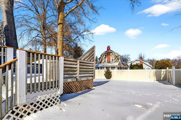 a view of a house with a yard from a balcony