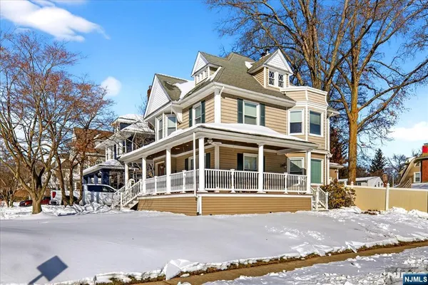 a front view of a building with a swimming pool