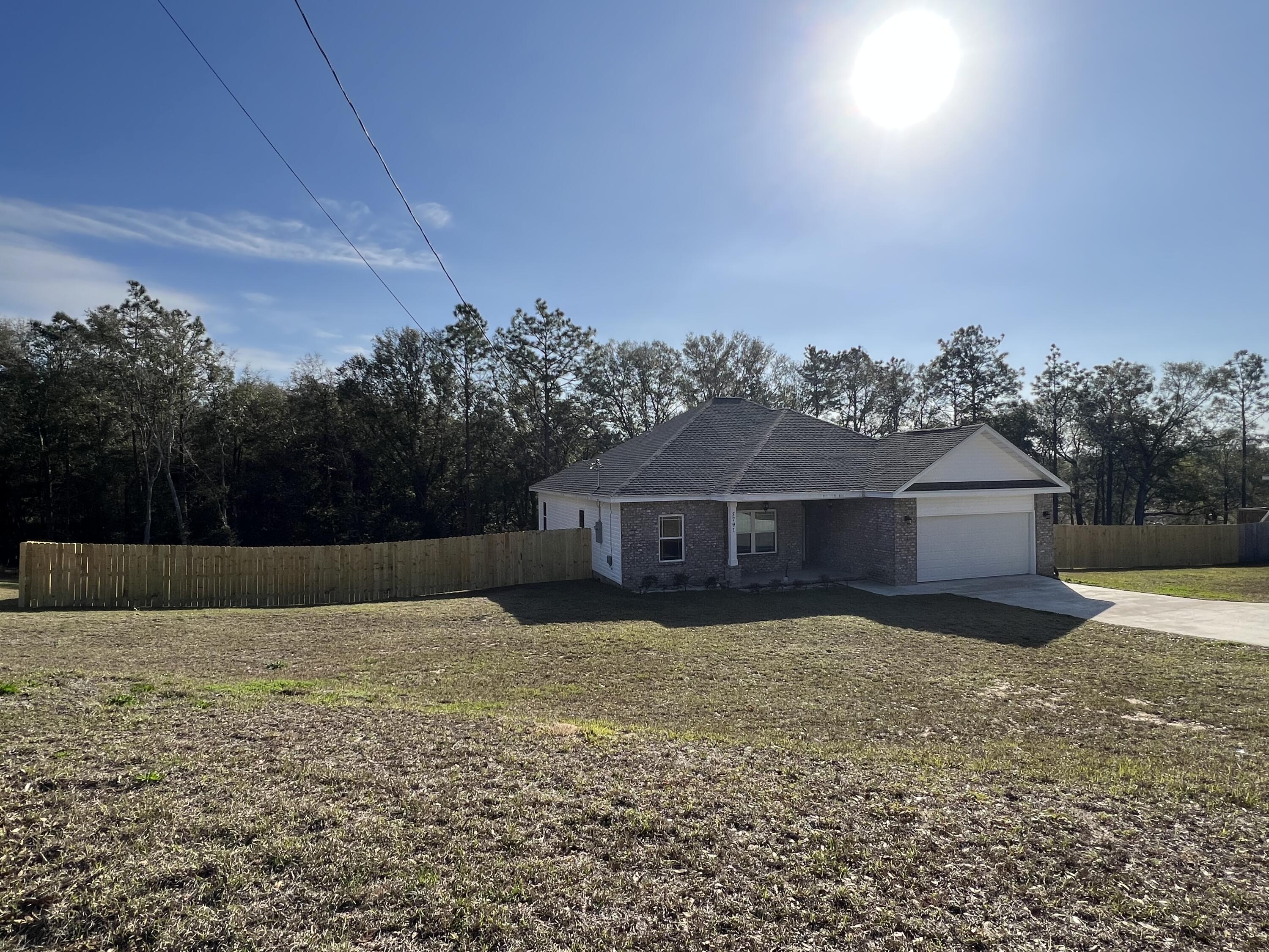 5791 Kellie Drive Crestview, FL 32539 - Photo 2 of 8 front view of a house with a yard