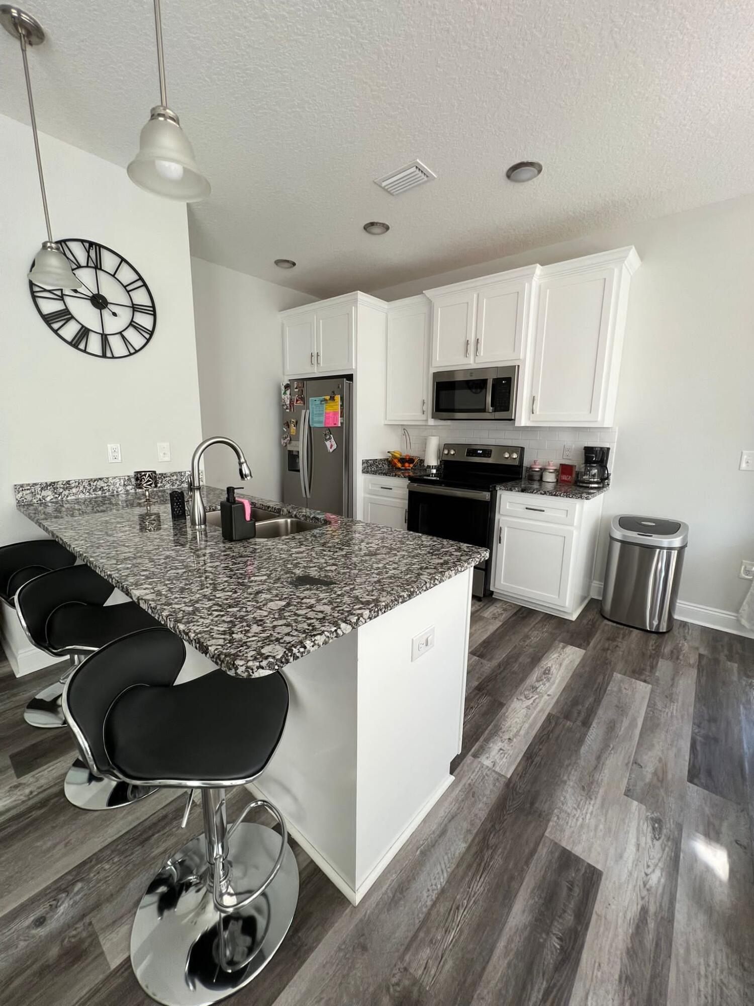 5791 Kellie Drive Crestview, FL 32539 - Photo 3 of 8 a kitchen with sink cabinets and appliances