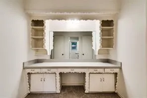 a bathroom with a sink toilet and mirror