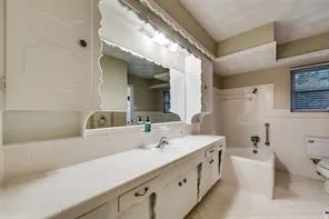 a view of a house with backyard and trees