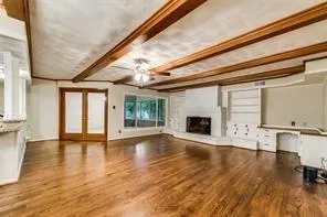 a view of an entryway with wooden floor and a window
