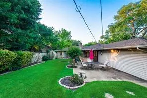 a view of a house with a big yard