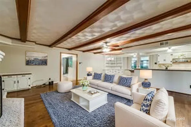 a living room with furniture and a rug