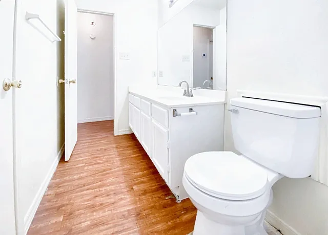a bathroom with a toilet and a shower