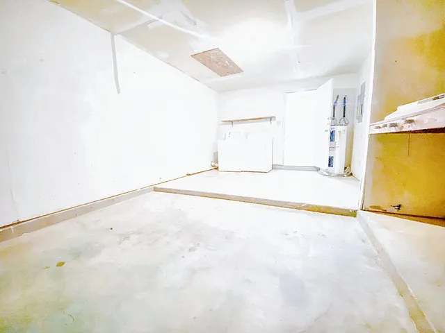 a view of backyard with a wooden fence