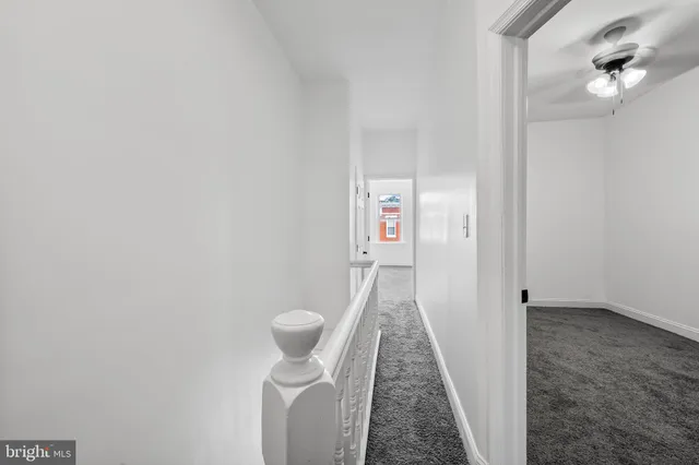 a view of a hallway with washer and dryer