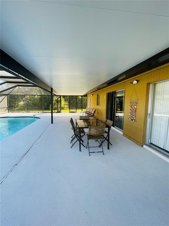 3405 Indiana Road Rotonda West, FL 33947 - Photo 15 of 17 a living room with furniture and a large window