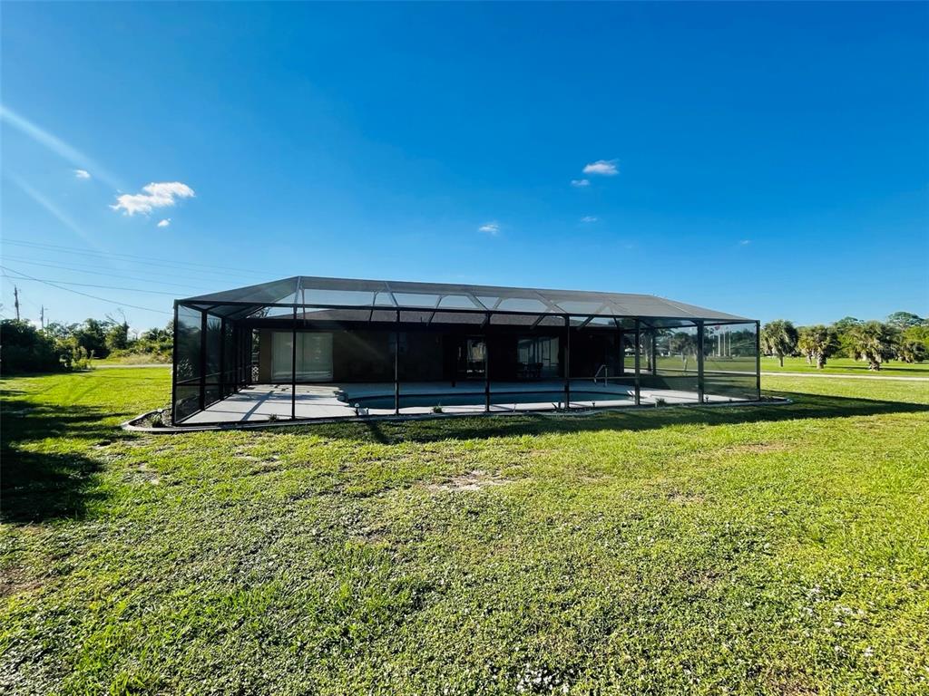 3405 Indiana Road Rotonda West, FL 33947 - Photo 17 of 17 a front view of a house with a yard