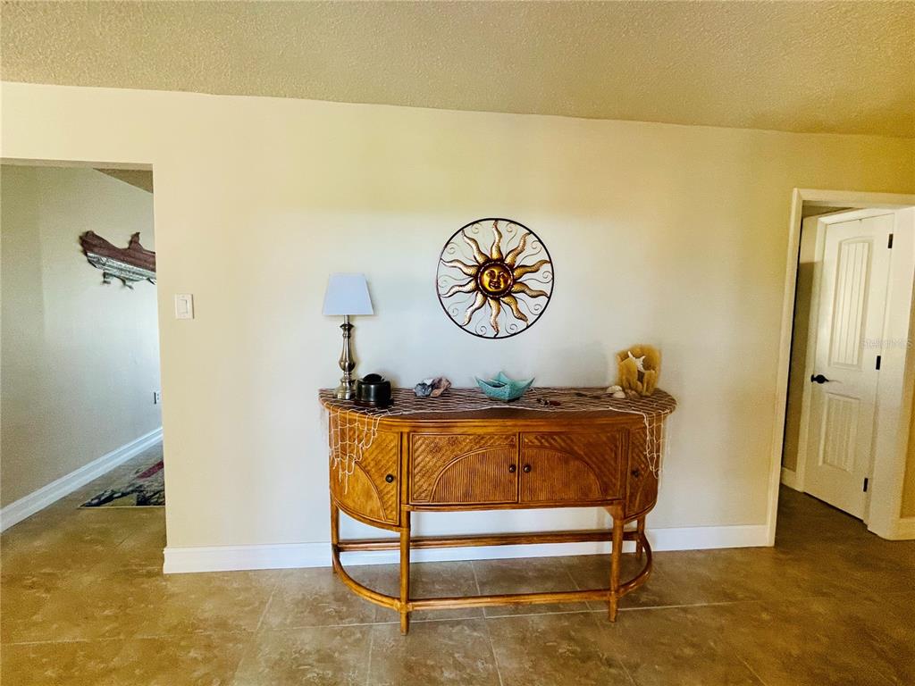 3405 Indiana Road Rotonda West, FL 33947 - Photo 4 of 17 a living room with a table