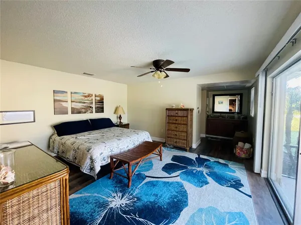 a bedroom with furniture and a wooden floor