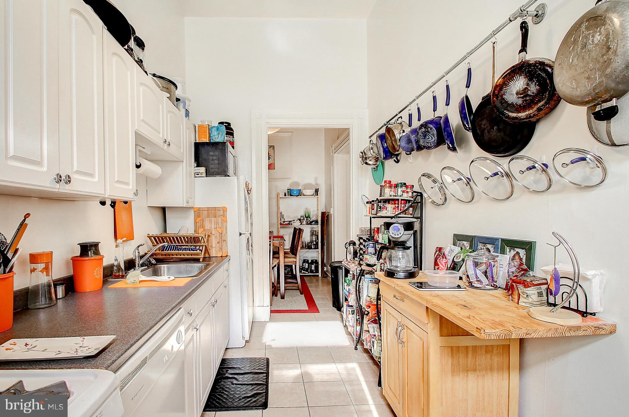 18 West Franklin Street Baltimore, MD 21201 - Photo 18 of 30 a kitchen with a sink and a stove