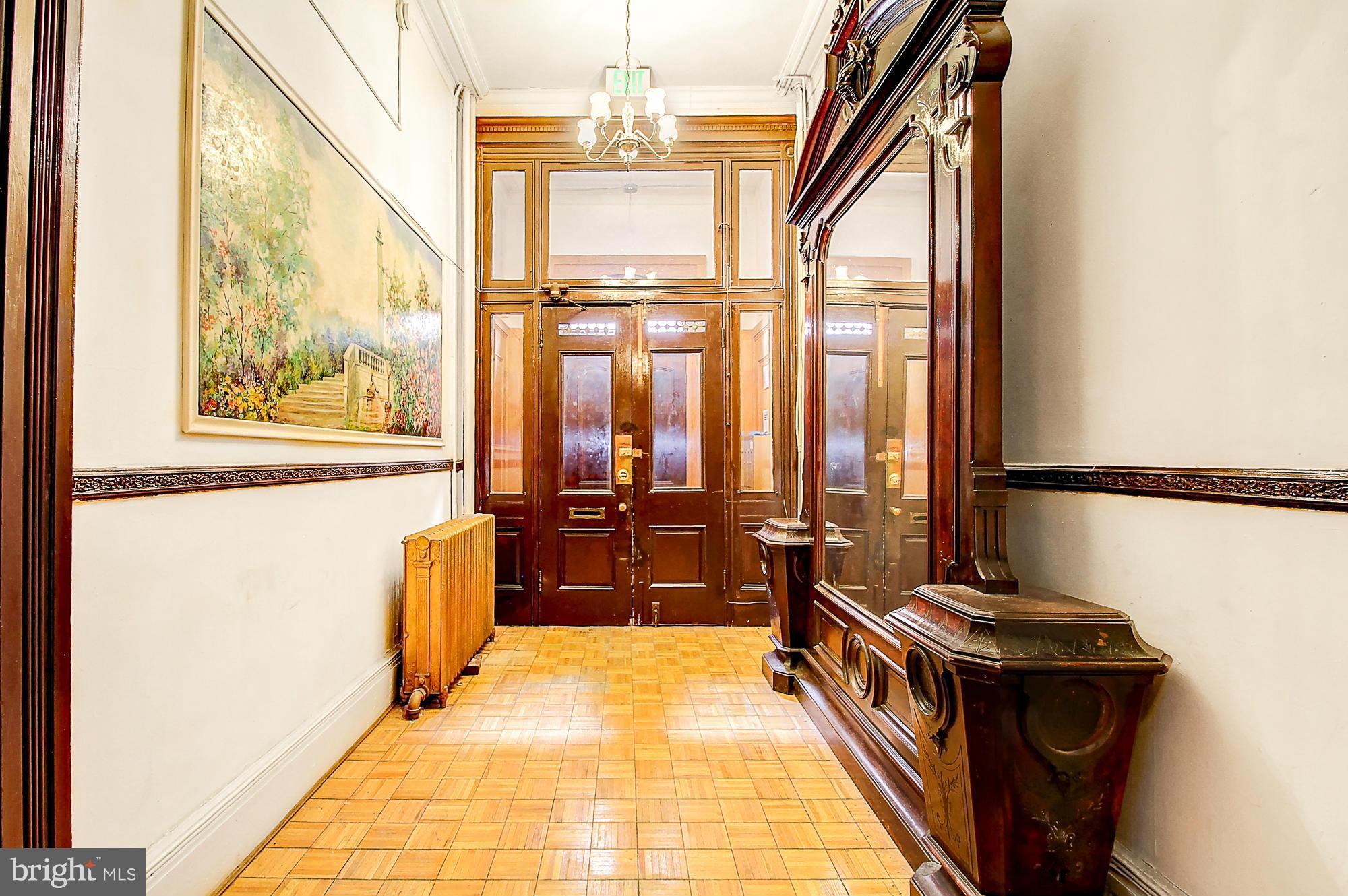 18 West Franklin Street Baltimore, MD 21201 - Photo 5 of 30 a hallway with a large window and furniture