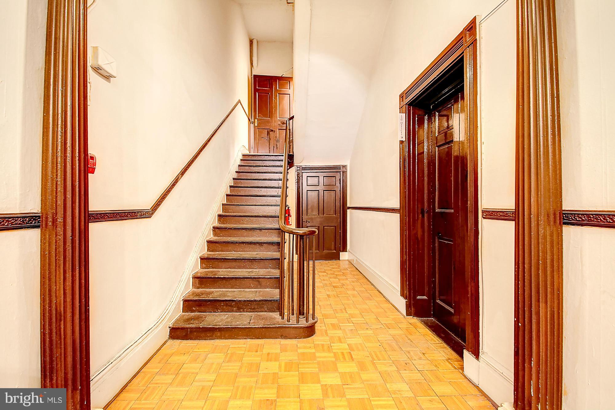 18 West Franklin Street Baltimore, MD 21201 - Photo 6 of 30 a view of entryway and hall with wooden floor