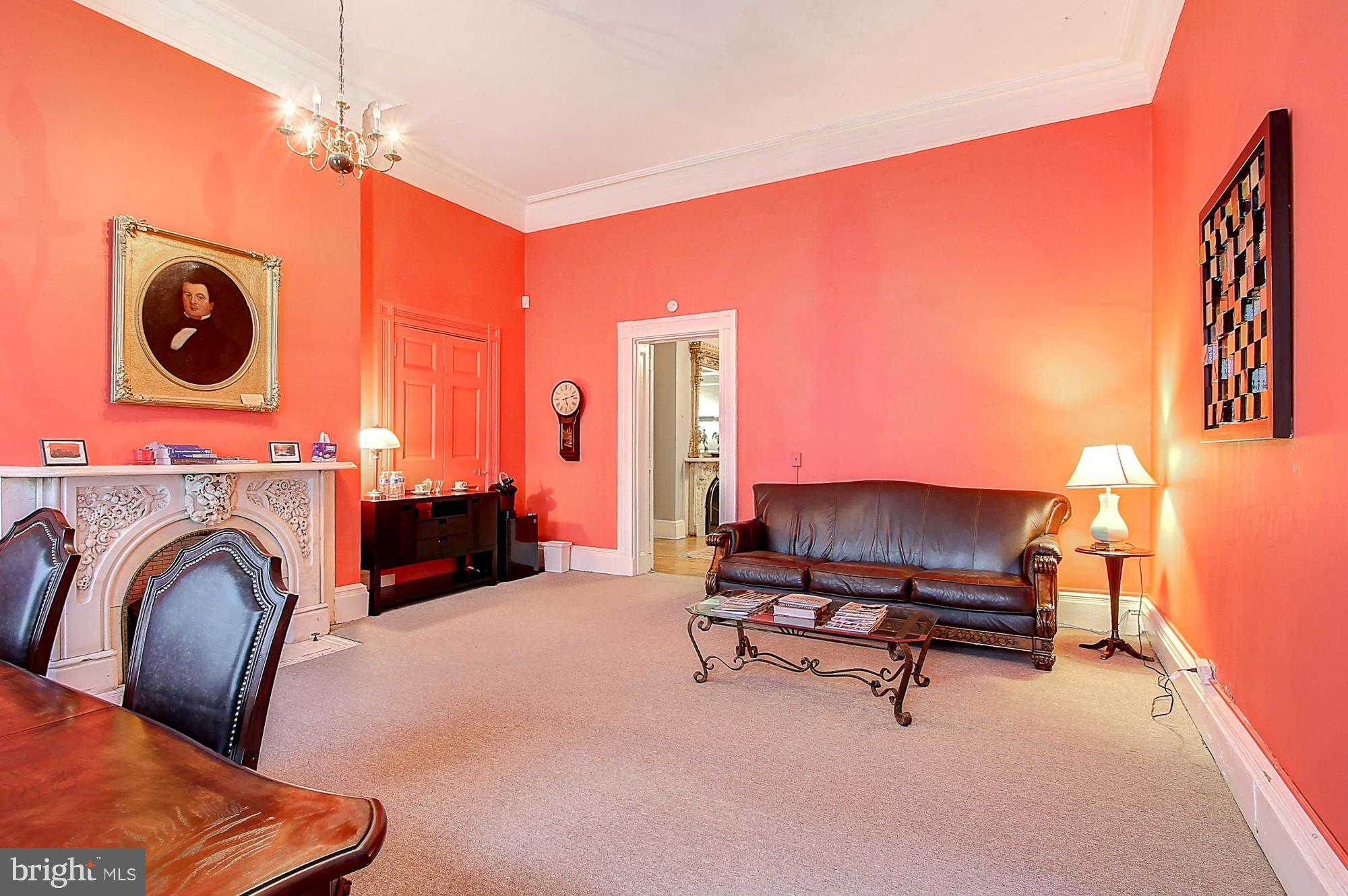 18 West Franklin Street Baltimore, MD 21201 - Photo 8 of 30 a view of a livingroom with furniture and a fireplace