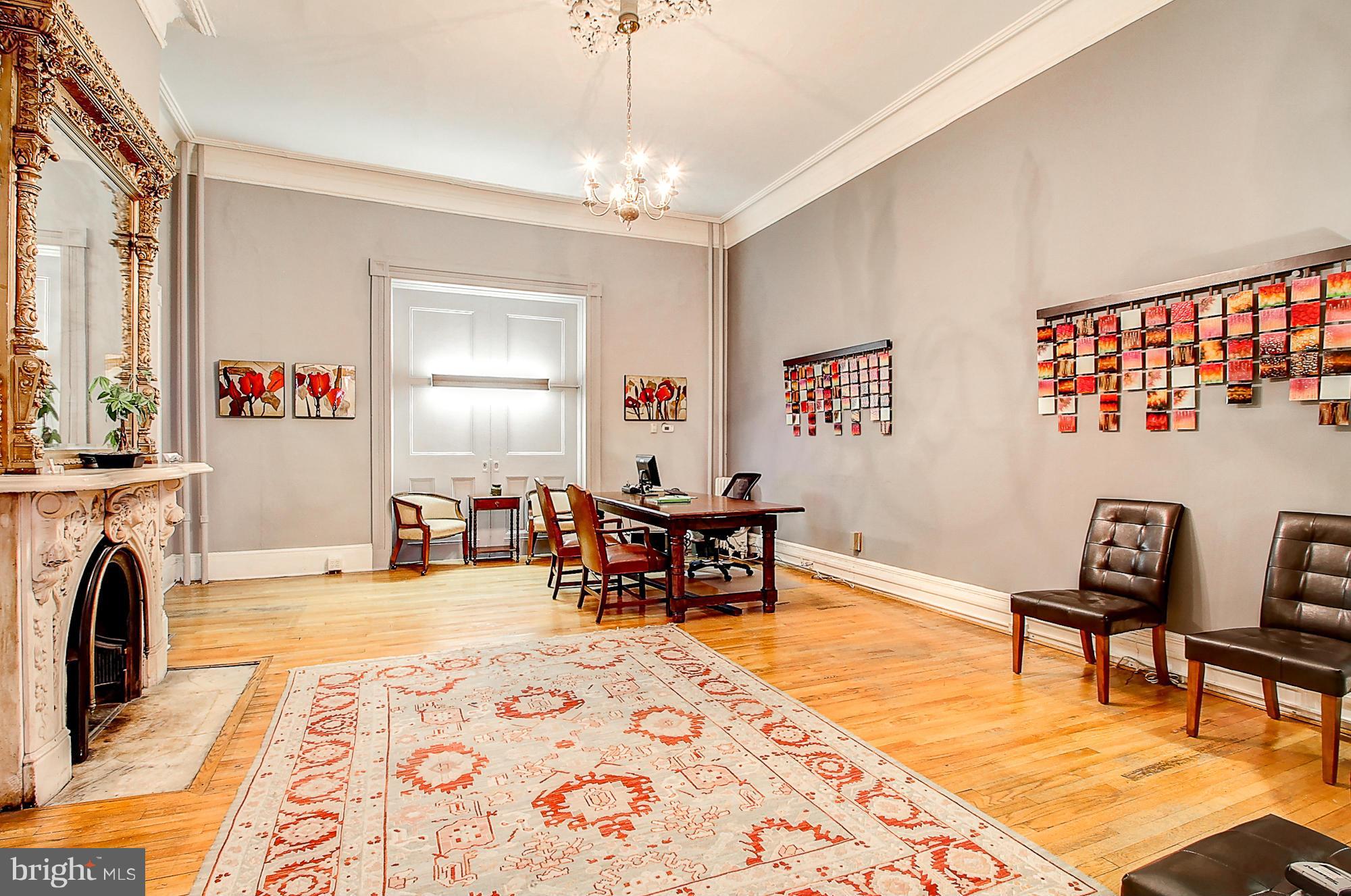 18 West Franklin Street Baltimore, MD 21201 - Photo 9 of 30 a living room with furniture and a fireplace