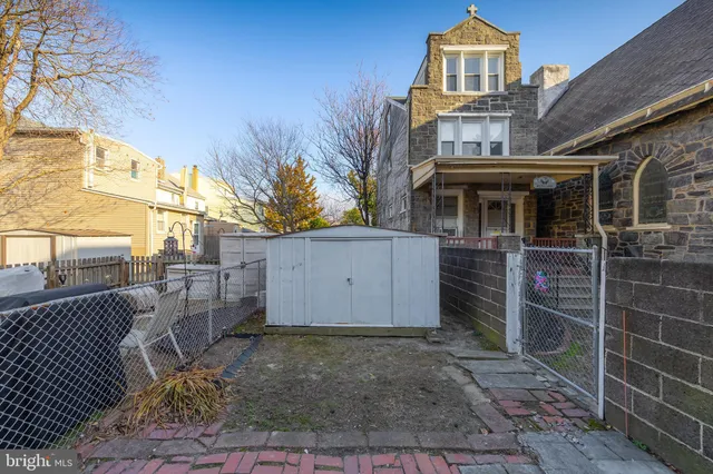 a view of empty room with wooden ceiling