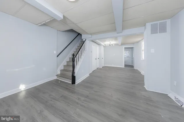 a view of an entryway with wooden floor
