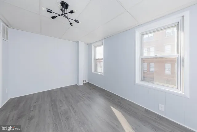 a view of an empty room with a window