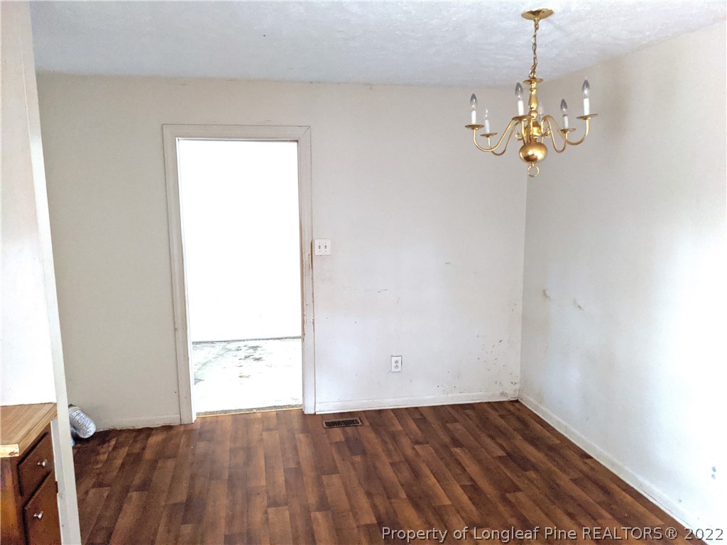 661 Azalea Drive Spring Lake, NC 28390 - Photo 3 of 7 a view of a room with wooden floor
