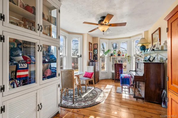 a living room with fireplace furniture and a window