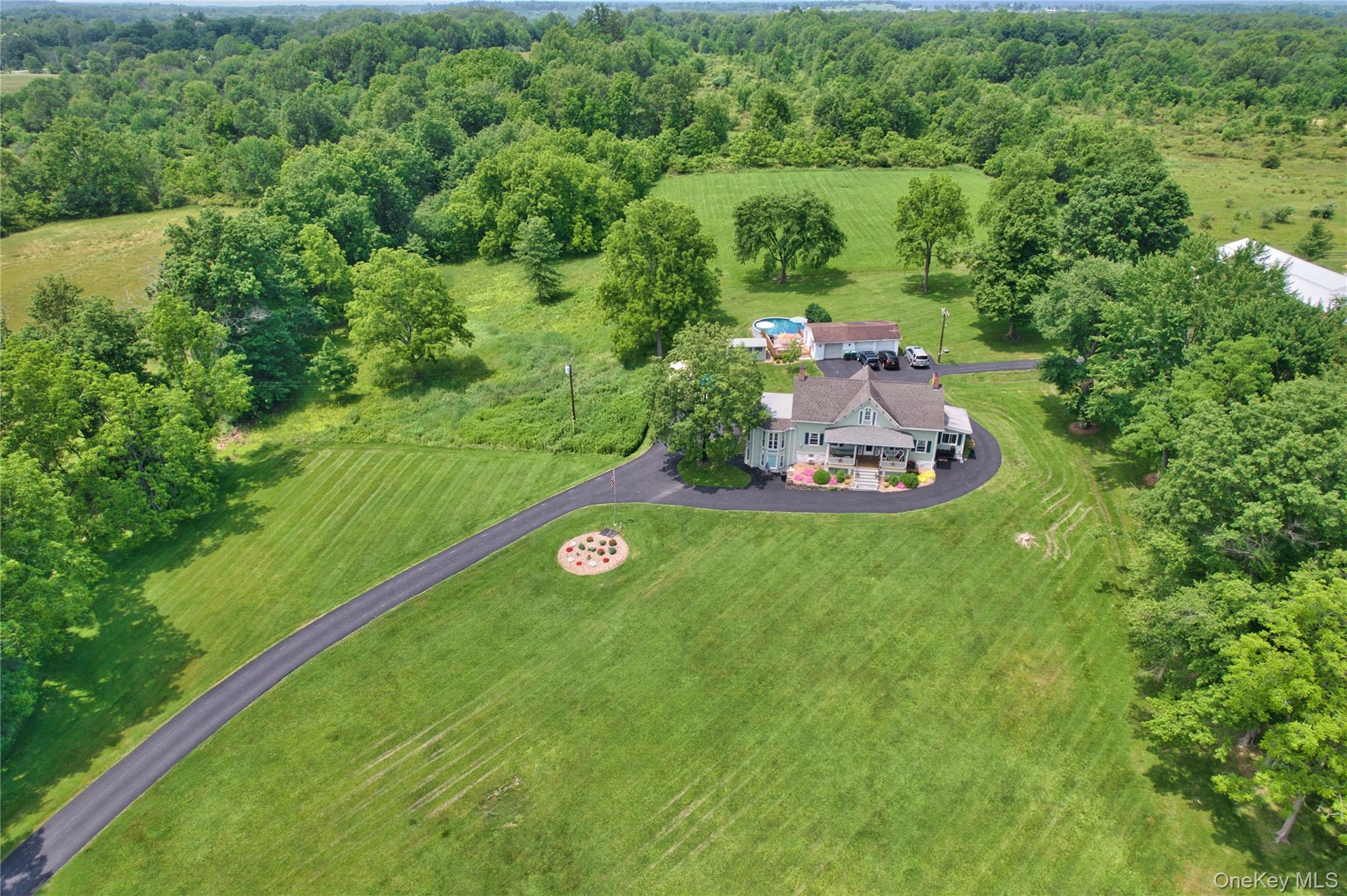 69 Lippincott Road Wallkill, NY 12589 - Photo 2 of 34 Aerial view of property and surrounding area featuring a forest
