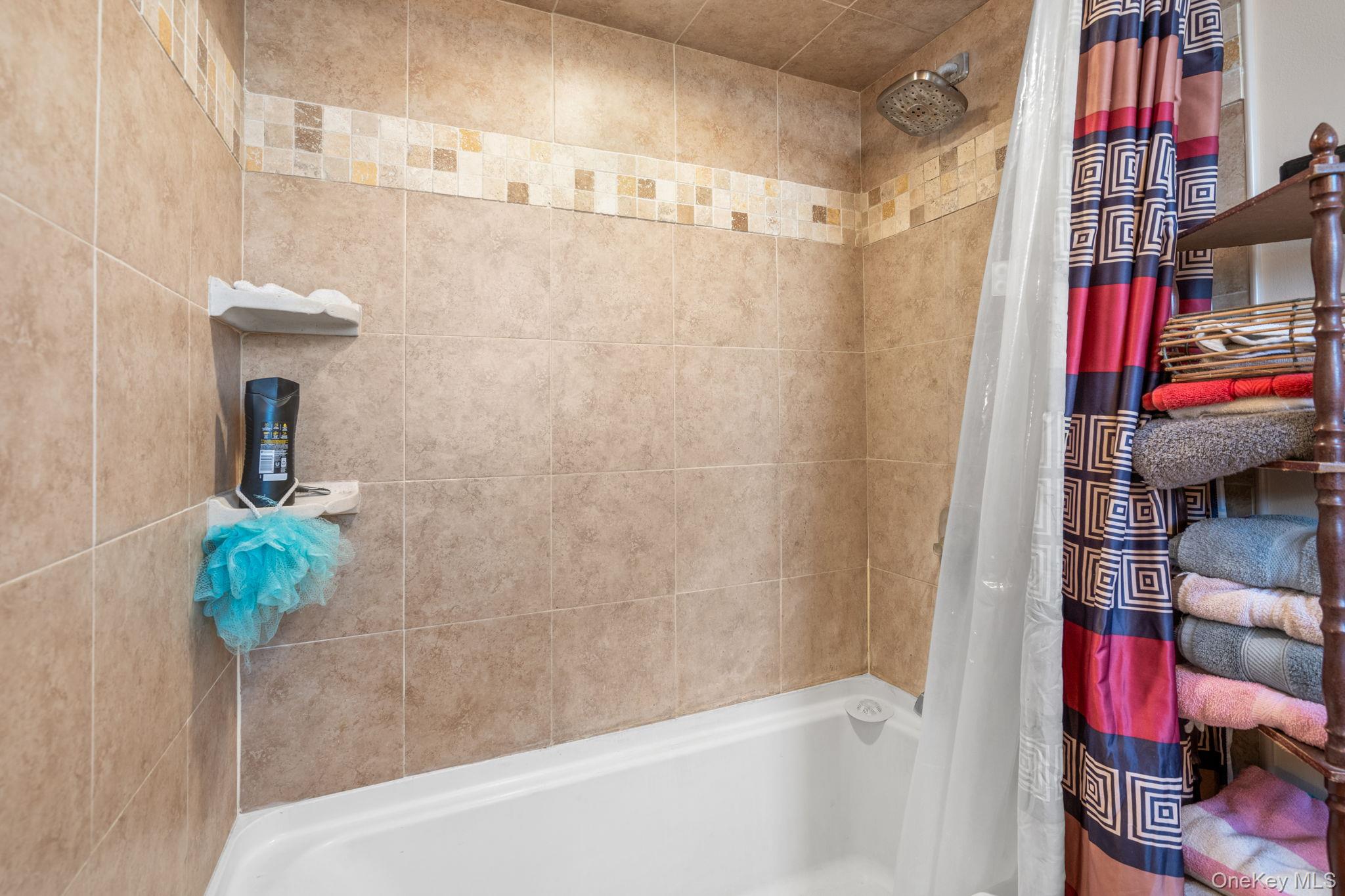 69 Lippincott Road Wallkill, NY 12589 - Photo 23 of 34 a bathroom with a shower and a shower