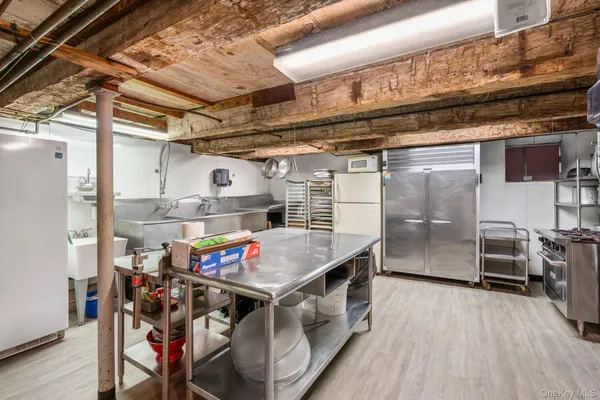 a kitchen with a stove and a refrigerator