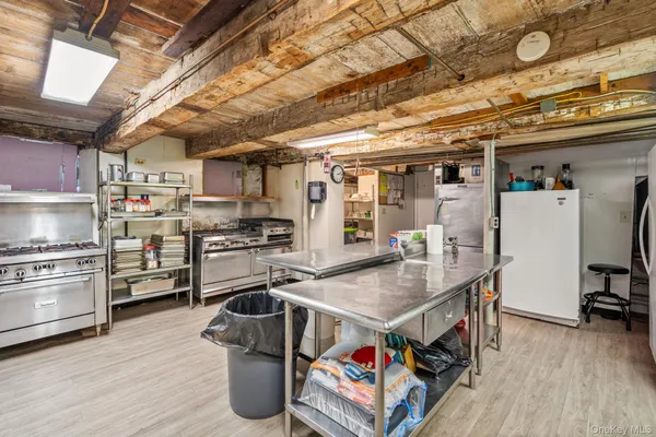 a kitchen with stainless steel appliances granite countertop a sink and wooden cabinets