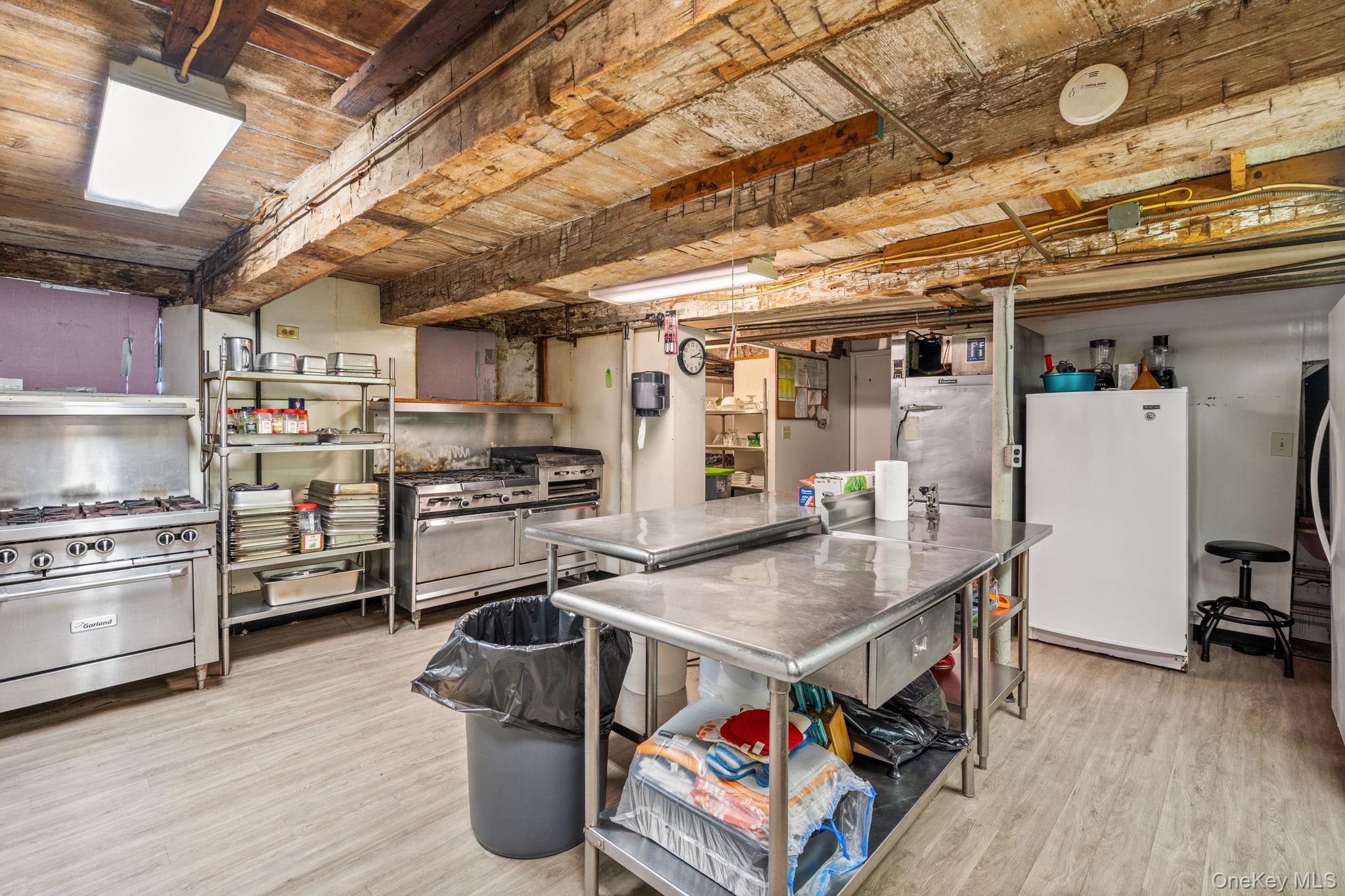 69 Lippincott Road Wallkill, NY 12589 - Photo 27 of 34 a kitchen with a stove and a refrigerator